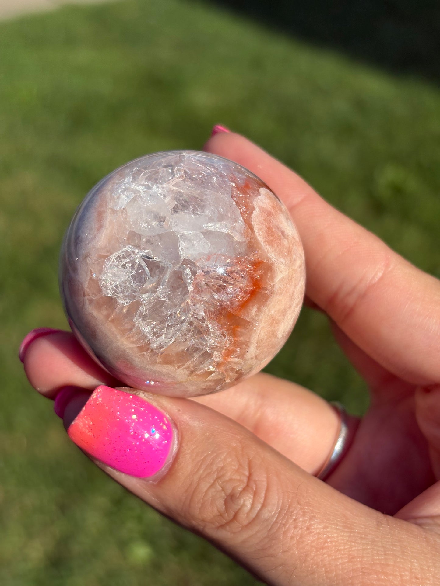 Rainbow filled pink amethyst sphere